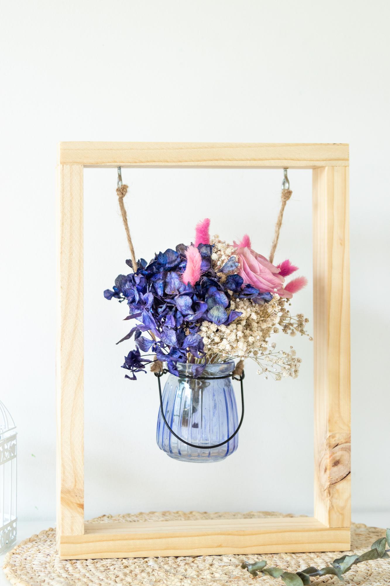 framed sampler on shelf