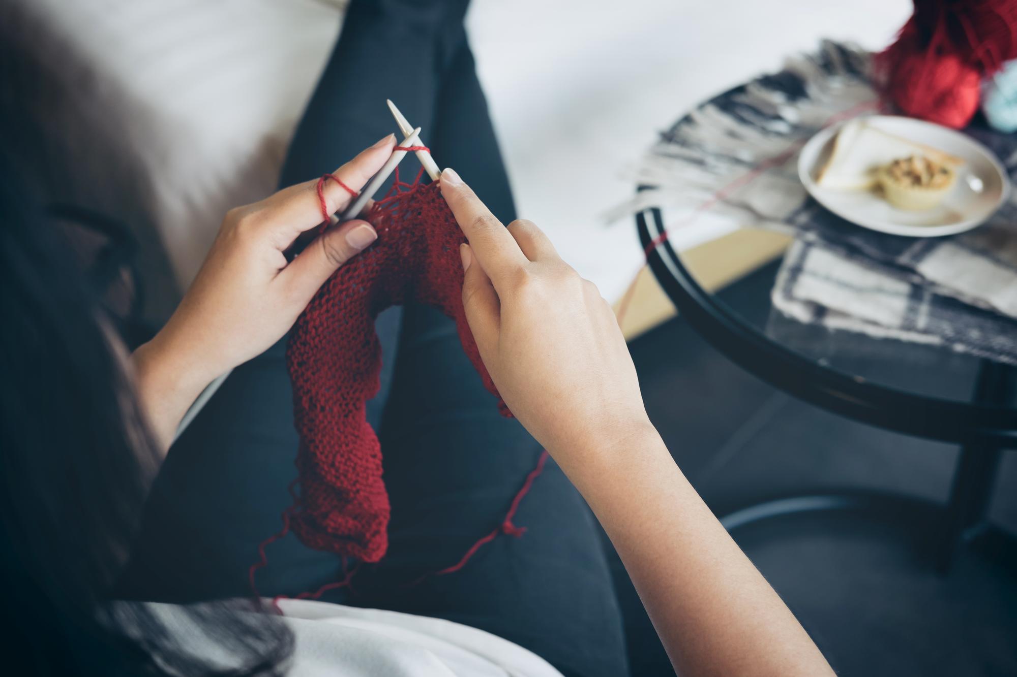 artisan stitching on linen in studio