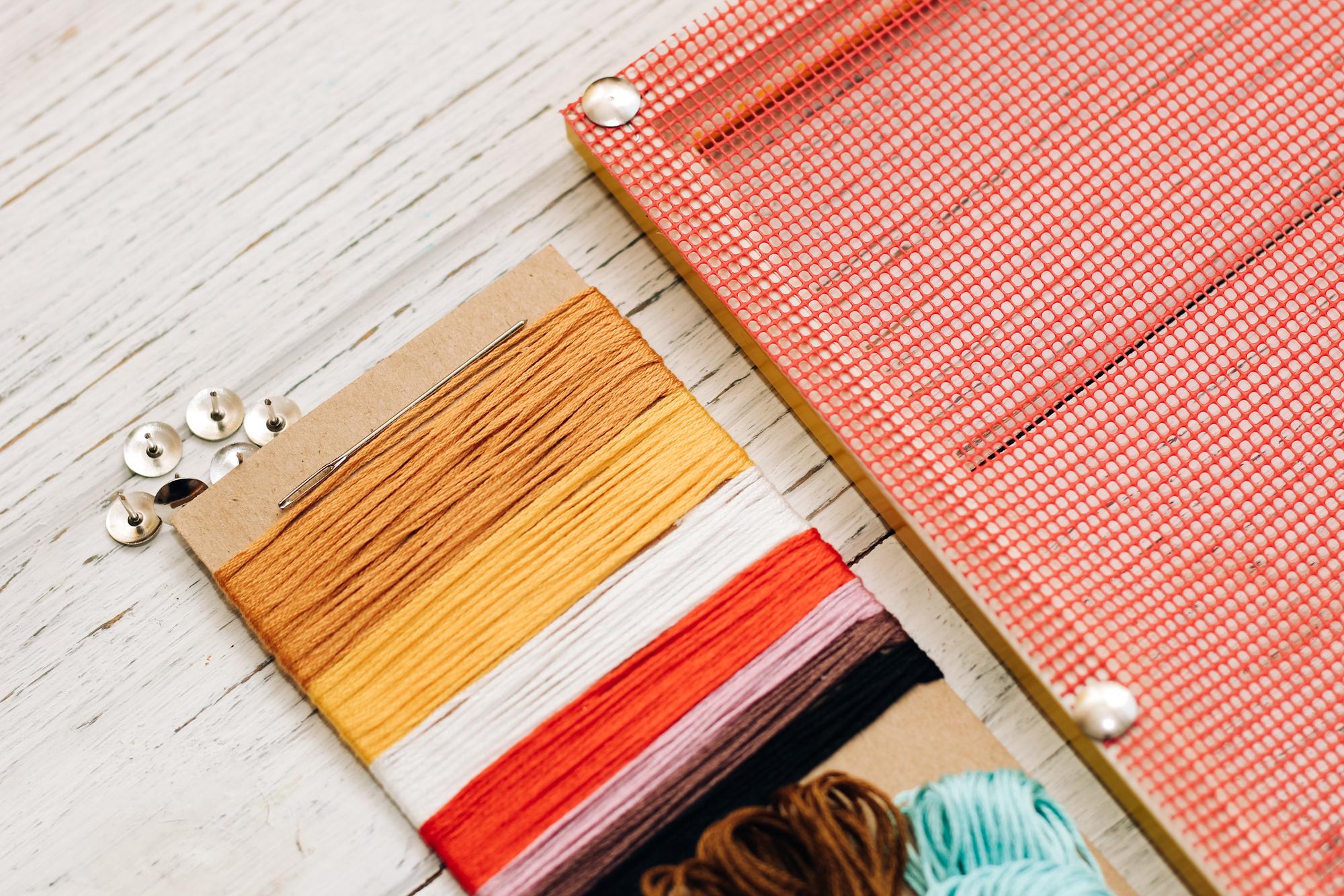 three stacked embroidered swatches